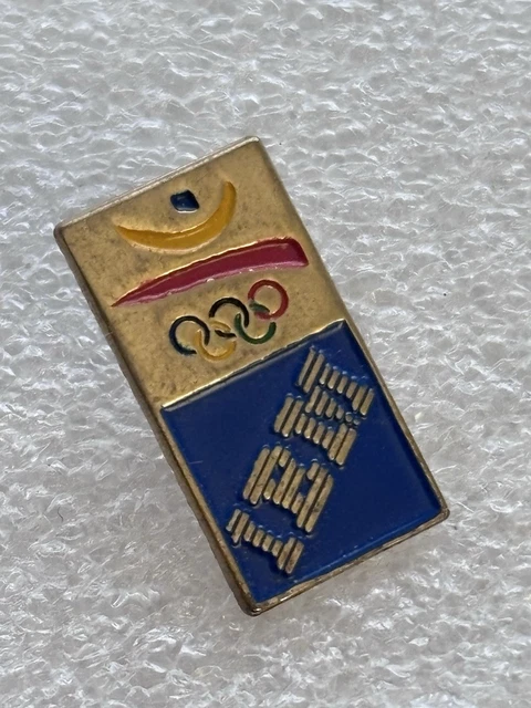 pin's JO Jeux Olympiques Barcelone 1992 - Seiko (doré signé 1988 COOB