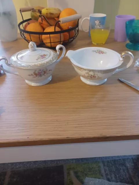 Noritake floral lidded sugar bowl and milk jug