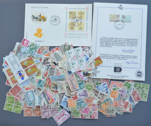 Lot de 600 timbres différents du Danemark dont 90 neufs + 1 enveloppe + 1 carte