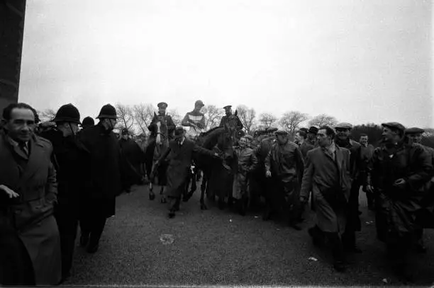 Jockey Pat Taaffe is pictured being led to the winning enclosure 1950s Old Photo