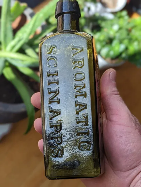 8" Olive Green Udolpho Wolfe’s Aromatic Schnapps Schiedam Iron Pontil Bottle