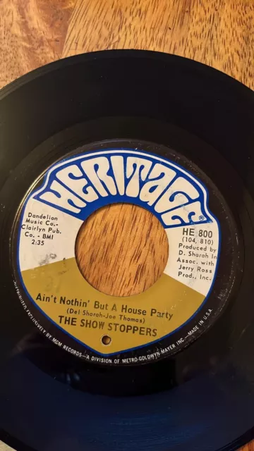 The Show Stoppers What Can A Man Do / Aint Nothin But A House Party (Heritage)