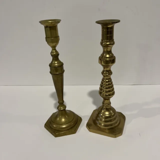 A pair of Vintage Solid Brass Mismatched Candle Stick Holders 10" tall