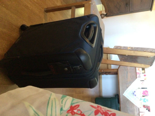 TUMI, Navy 22” expandable 4-spinner luggage (used once)
