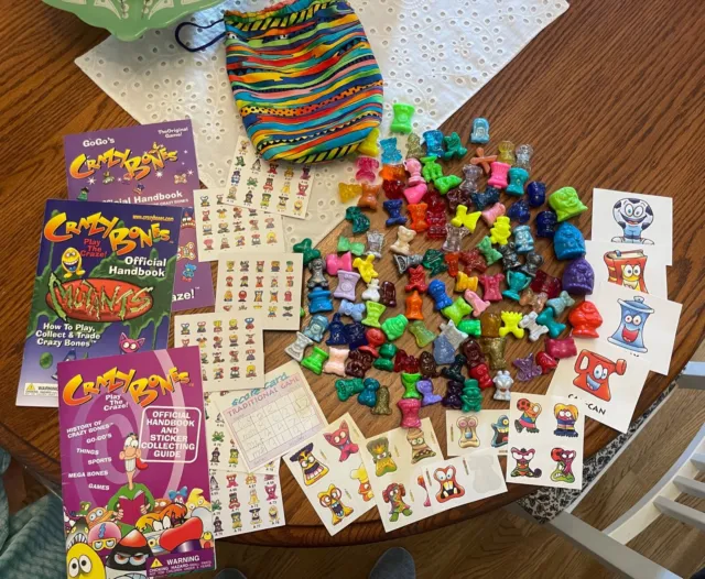 Crazy Bones Lot of 110 Game Pieces With Official Handbook GoGo's Mutants Sticker