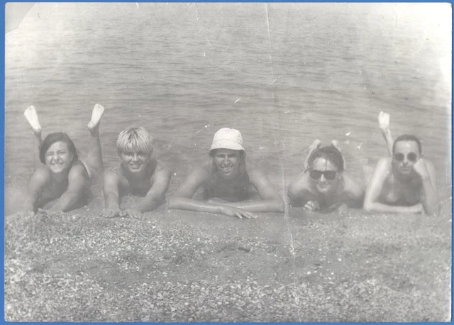 Beautiful guys and girls on the beach near the sea Vintage photo