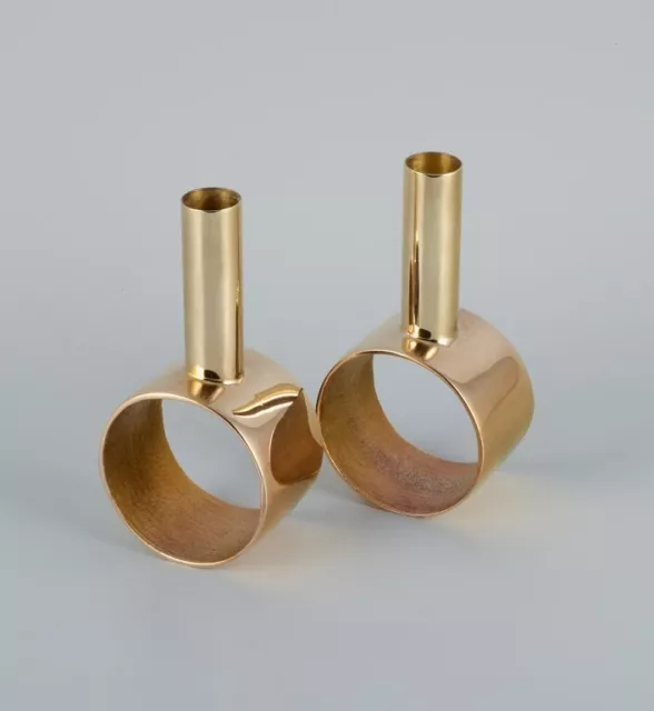 Swedish design. A pair of  brass candlesticks. Late 20th C.