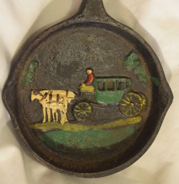 TS-018 NC, Manteo Souvenir Amish Wagon w Oxen Cast Iron Ashtray Skillet