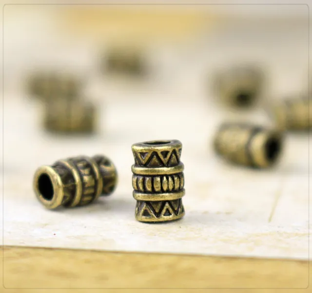 10 Perlen Spacer Zwischenteil Schmuck DIY bronze Röhre antik Inka Muster 7x5mm