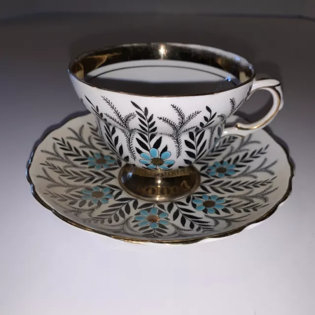 Rosina Cup & Saucer Stylized Turquoise Flowers Black Leaves Heavy Gold Band 5197