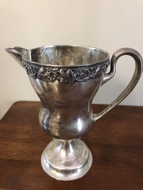 Antique sterling large pitcher....Very old with anchor and lion passant.