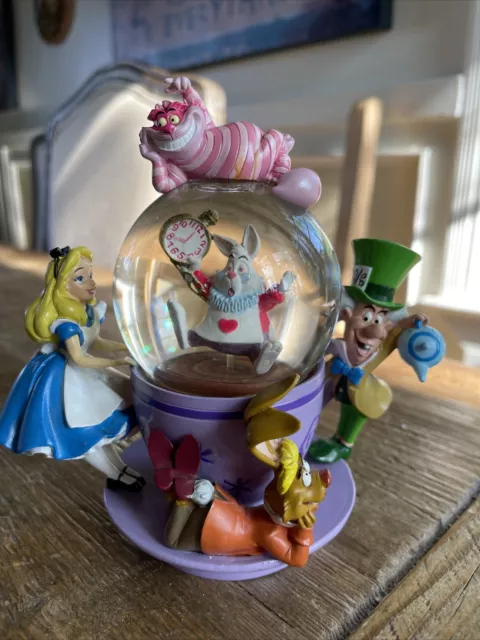 Disney Alice In Wonderland Snow Globe Tea Cup Figurine Disney Alice In Wonderland Snow Globe Tea Cup Figurine