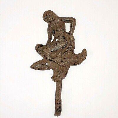 Cast iron Mermaid sitting on a Starfish wall hook, natural rust patina, 8"
