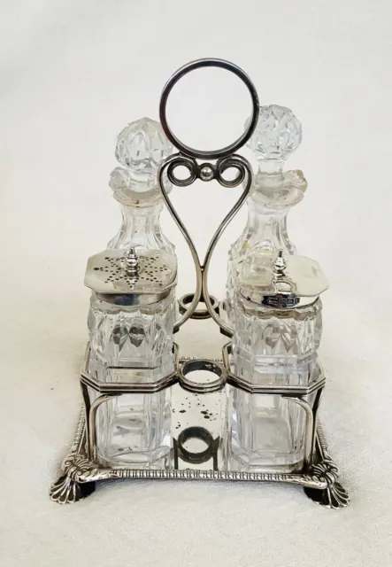 VICTORIAN STERLING SILVER FOUR PIECE CRUET - Atkins Brothers, Sheffield, 1898.