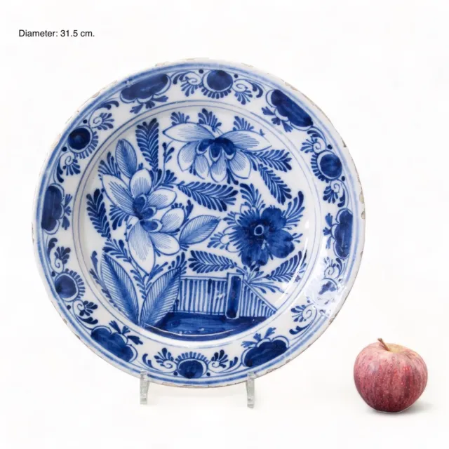 Nice large Dutch Delft Blue charger, flowers in a garden, 18th century.