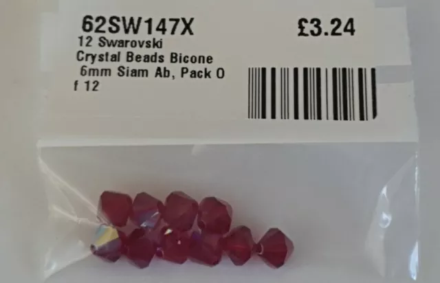 PERLES DE BICONE EN CRISTAL SWAROVSKI. LOT DE 10 RUBIS 6 mm