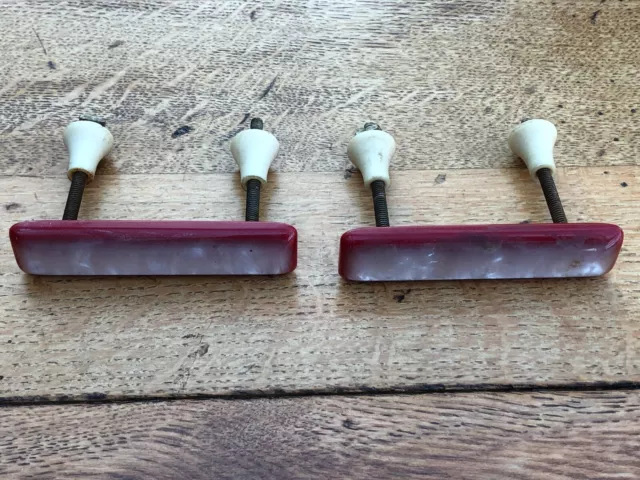 pair of 1950s red and white kitchen cabinet or draw handles !