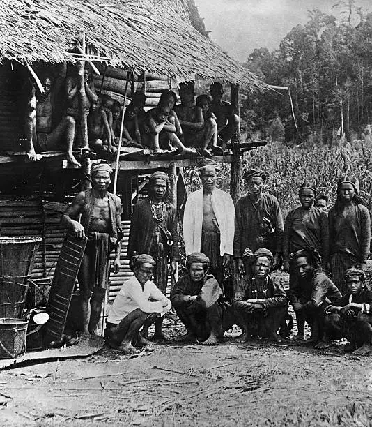 Dayak Warrior in front of their hut 1910 Historic Old Photo