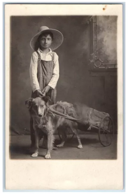 c1910's Boy With His Dog Pulling Cart Wagon Farmer Hat RPPC Photo Postcard