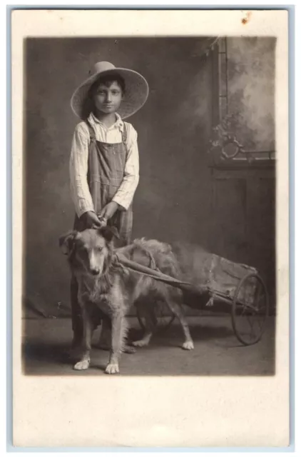 c1910's Boy With His Dog Pulling Cart Wagon Farmer Hat RPPC Photo Postcard c1910's Boy With His Dog Pulling Cart Wagon Farmer Hat RPPC Photo Postcard