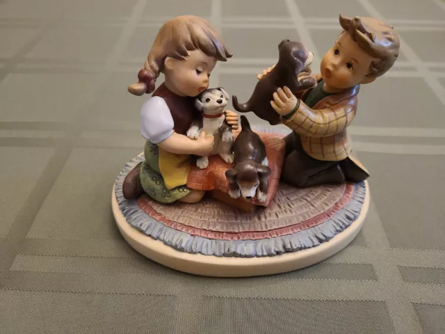 hummel “Puppy Surprise” from the Danbury Mint collection. Too Beautiful.