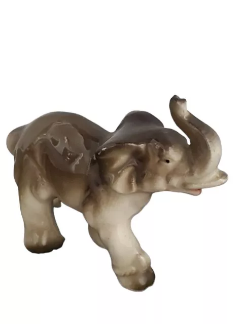 Antique Porcelain Miniature Elephant With Trunk Up. Made in Japan