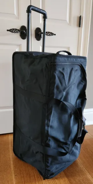 TUMI Black Large Two Wheel Traveling Duffle Bag Numerous Pockets
