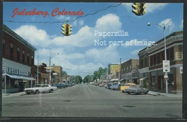 CO Julesburg CHROME c.1960 MAIN STREET SCENE Cars STORES by Mike Roberts