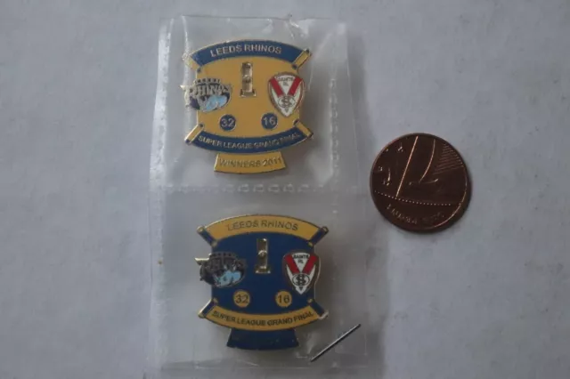 Two Leeds Rhinos v St Helens Rugby League enamel Badges 2011 Grand Final winners