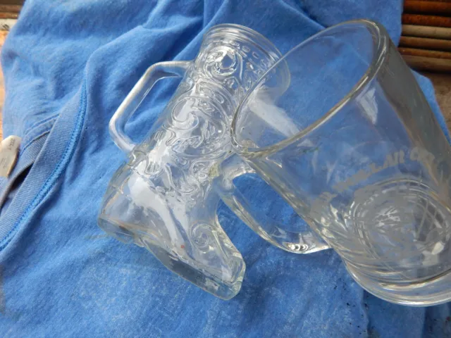 2 antique silver dollar city glass mugs