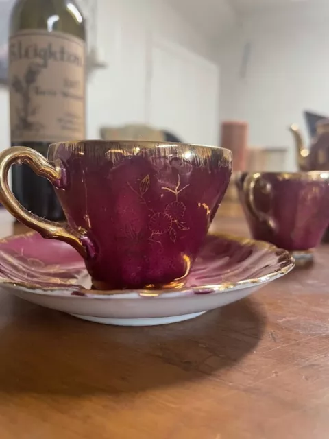 Purple China tea set. 5 cups & saucers, creamer boat, tea pot, and sugar holder