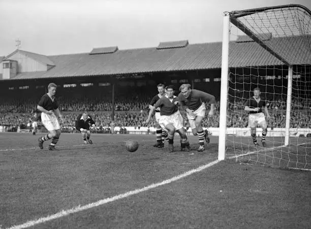 Manchester City goalkeeper Bert Trautmann second right pounces- 1955 Old Photo