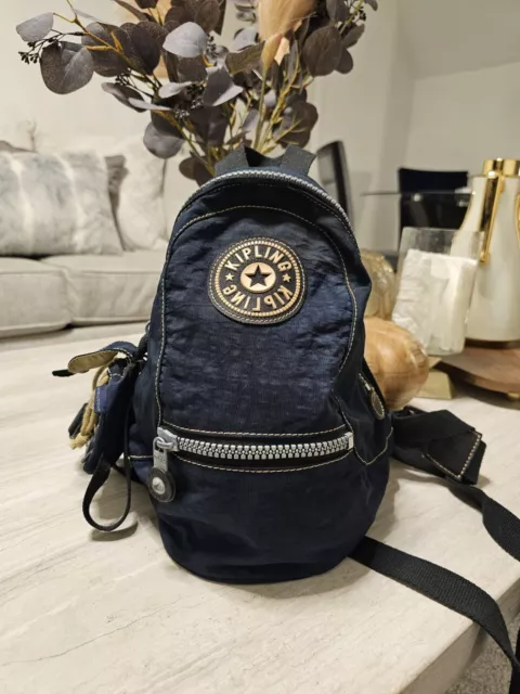 Kipling backpack with keychain monkey characteristic