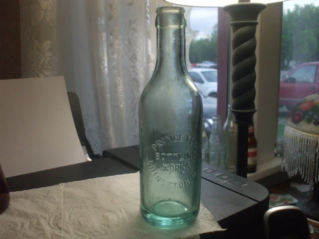 princeton  Bottling Works Princeton, minn  vintage bottle crude. corn flower.blu