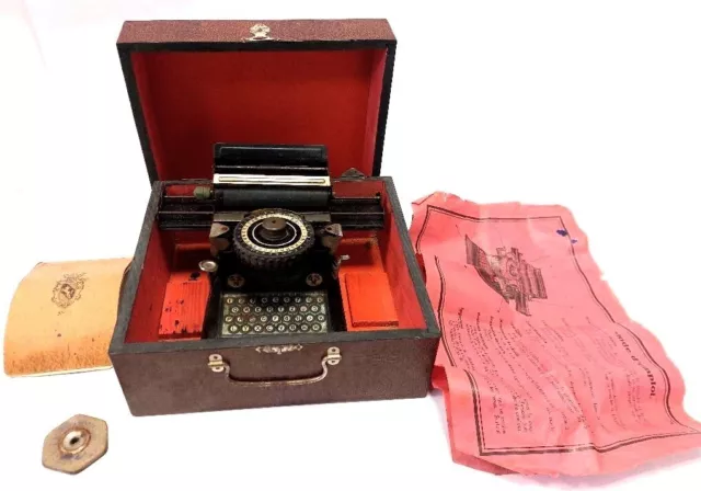 Antigua maquina de escribir de juguete  JUNIOR, tin toy typewriter+box 1920