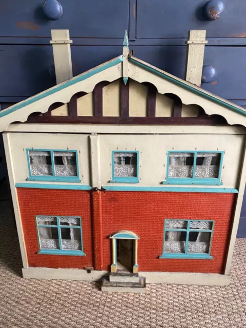 Large 1930's Wooden Vintage Doll House with a few furnishings.