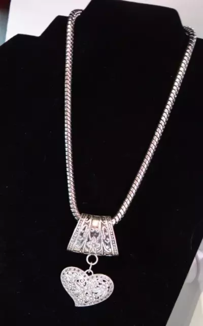 Necklace Silvertone Pendant is very nice it is heavy