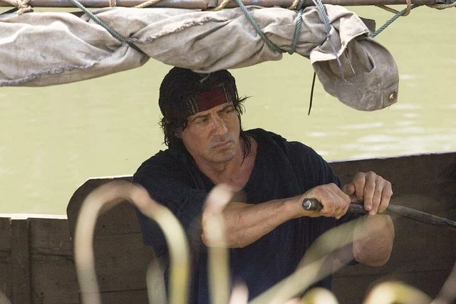 SYLVESTER STALLONE AS John Rambo navigate boat Burma river Rambo 2008 ...
