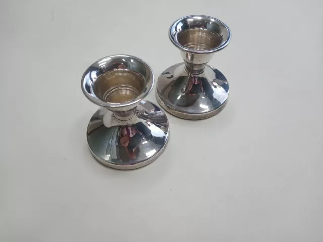 Pair of Birmingham silver hallmarked small candlesticks (filled bases).