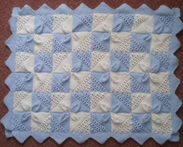 Beautiful hand knitted baby blue and white pram/cot blanket