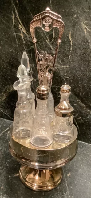 Silverplated Victorian 6 Bottle Carousel Cruet Set