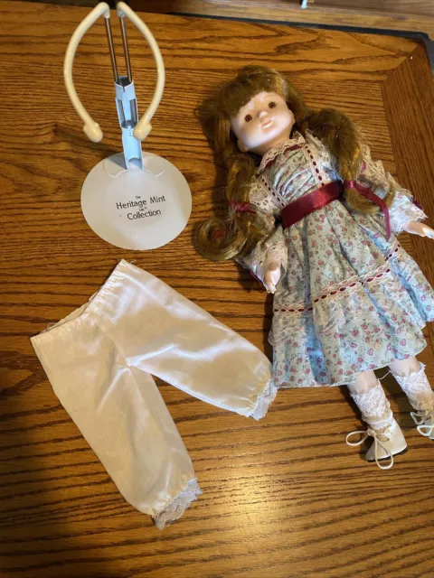 The Heritage Mint LTD Doll collection , porcelain. Beautiful Dress !With Stand .