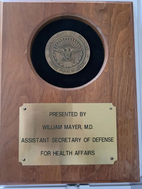 Wooden Plaque. "Presented by William Mayer, MD. Assistant Secretary of Defense.