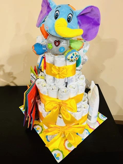 Diaper cake with lots of baby essentials. Cute and useful!