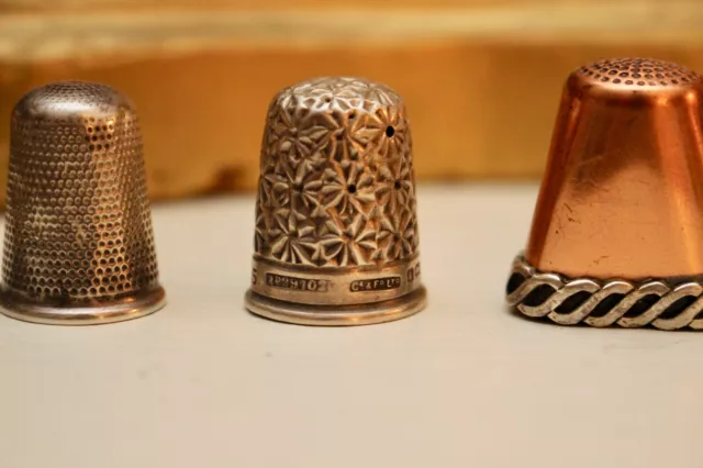A Group of Antique Silver and Copper Thimbles in Distress 2