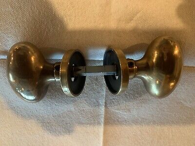 Baldwin heavy antique brass oval knob set with escutcheons and spindle