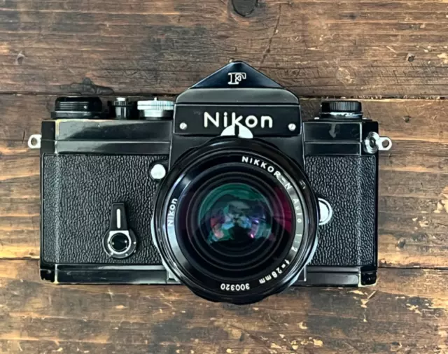 Patina  Nikon Apollo F SLR Black Eye Level Prism Camera with Nikkor 28mm F2 Lens