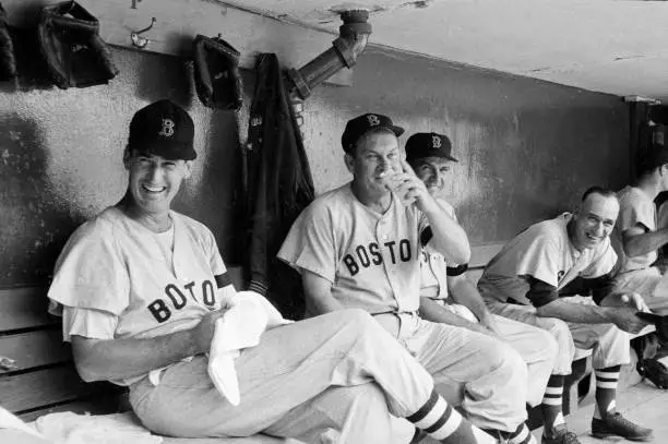 Boston Red Sox Ted Williams in dugout during game vs Cleveland Ind - Old Photo