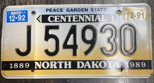 1992  North Dakota ND License Plate J 54930 Centennial Tag Vintage Man Cave Auto