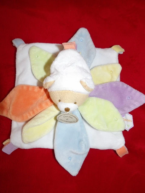 Doudou et Compagnie Plat Ours Arc En Ciel Blanc Pétale Bleu Orange Vert